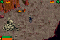 LEGO Bionicle (Game Boy Advance) screenshot: The first boss is this rock monster, which has captured the village elder.