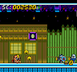 Super Air Zonk: Rockabilly-Paradise (TurboGrafx CD) screenshot: ...and little guys shooting at you, with fake houses as background