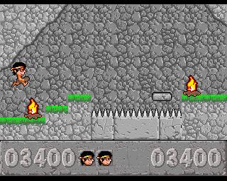 Jurajski Sen (Amiga) screenshot: Jumping above the fire