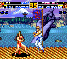 Fatal Fury 2 (TurboGrafx CD) screenshot: Mai tries to predict the opponent's move. Note the background changes as the screen scrolls