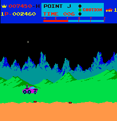 Moon Patrol (Arcade) screenshot: Jumping over the mines