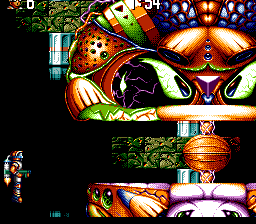 Jim Power in "Mutant Planet" (TurboGrafx CD) screenshot: Fighting a boss while flying with a jetpack. You need to hit his eye, obviously