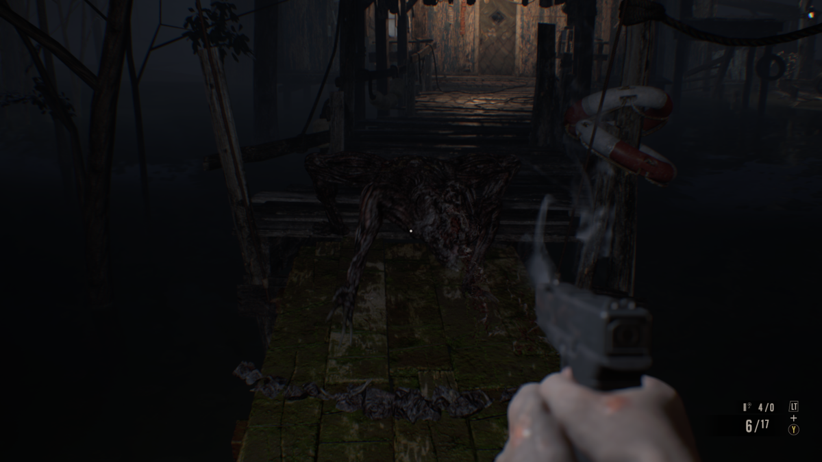 Resident Evil 7: Biohazard (Windows) screenshot: Shooting a fast four-legged Molded at the pier