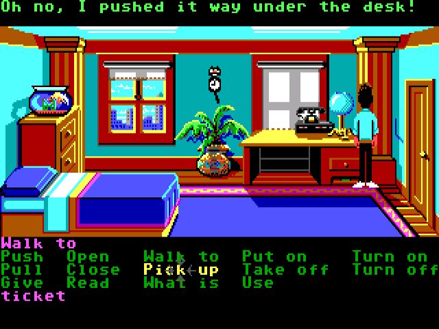 Zak McKracken and the Alien Mindbenders (Windows) screenshot: While trying to reach his cash card, Zak pushed it further under the desk (GOG release, Floppy version)