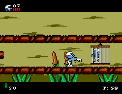 The Smurfs (SEGA Master System) screenshot: The defeated boss leaves the key for the imprisoned smurf's cage.