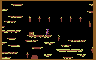 Quo Vadis (Commodore 64) screenshot: Treasure chests will replenish your health. You can tell I am low on health by my character's purple color.