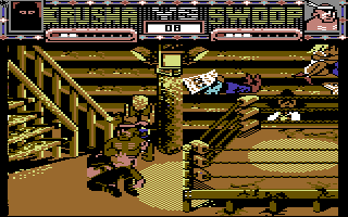 Sgt Slaughter's Mat Wars (Commodore 64) screenshot: The native American wrestler tosses Krusha out of the ring