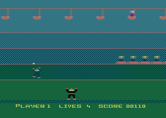 Carnival Massacre (Atari 8-bit) screenshot: The villain is planting bombs on the track