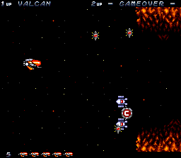 Legion (TurboGrafx CD) screenshot: Getting started. Basic weapon power-up carried by two enemy ships
