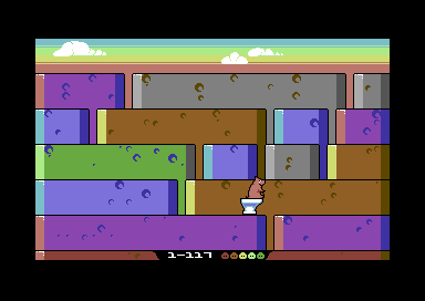 Quod Init Exit (Commodore 64) screenshot: Catching the toilet to end level