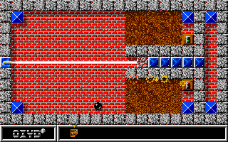 Oxyd (Amiga) screenshot: Beam away the blocks with the laser in order to access some of the stones. Don't touch it, though!