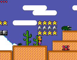 Toto World 3 (SEGA Master System) screenshot: Desert area. Alligators, guitar players... what, no guitar players? Oh, ok...