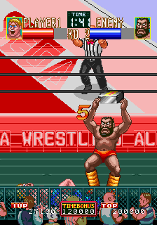 Wrestle War (Arcade) screenshot: Fighting out of the ring.