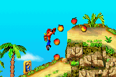 Crash Bandicoot 2: N-Tranced (Game Boy Advance) screenshot: To collect some Wumpa Fruits, Crash is forced to jump'n a cliff.