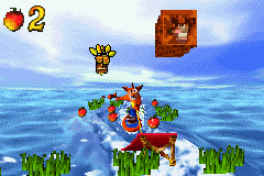 Crash Bandicoot 2: N-Tranced (Game Boy Advance) screenshot: Using his wakeboard, Crash must head up the ramp to get-break a Crash Crate.
