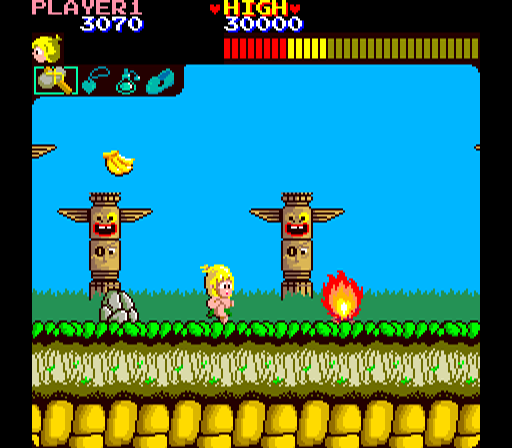 Wonder Boy (Arcade) screenshot: Jump the flames.