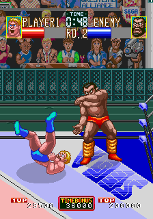 Wrestle War (Arcade) screenshot: Thrown to the canvas.