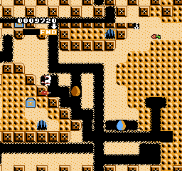 Hottāman no Chitei Tanken (NES) screenshot: Laying a dynamite stick in oder to remove a block