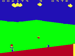 Eddie Steady Go! (Dragon 32/64) screenshot: Fourth level - jump over the rolling boulders
