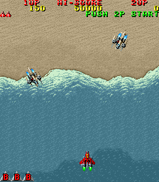Raiden (Arcade) screenshot: Approaching land.