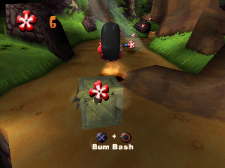 Disney's Lilo & Stitch: Trouble in Paradise (PlayStation) screenshot: Lilo uses bum bash move to destroy this crate.