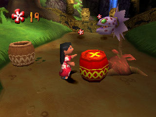Disney's Lilo & Stitch: Trouble in Paradise (PlayStation) screenshot: Lilo drops a TNT barrel, run!