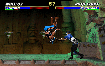 Mortal Kombat 3 (Arcade) screenshot: Stryker uses stick to throw Nightwolf