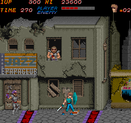 Trojan (Arcade) screenshot: Dynamite man in the window