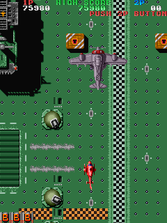 Twin Cobra (Arcade) screenshot: Destroy all on deck.