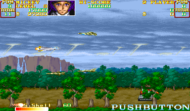 U.N. Squadron (Arcade) screenshot: Above the forest.