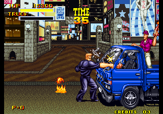 Burning Fight (Arcade) screenshot: Punching the van.