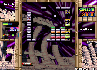 Arkanoid Returns (Arcade) screenshot: Smart bomb destroyed some blocks.