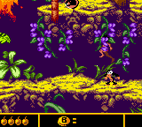 Walt Disney's The Jungle Book: Mowgli's Wild Adventure (Game Boy Color) screenshot: Jumping on a foe.