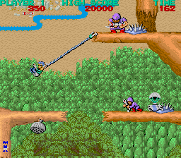 Bionic Commando (Arcade) screenshot: Swinging across.