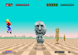 Space Harrier (Arcade) screenshot: Blast the heads.
