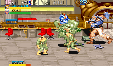 Captain Commando (Arcade) screenshot: Boss fight while riding a mech