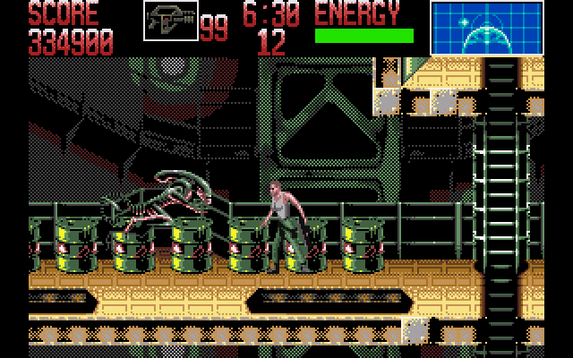 Alien³ (Amiga) screenshot: Tip: Pick one of the drums up, then throw it at the alien