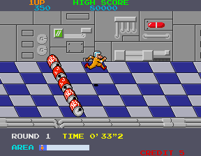 Metro Cross (Arcade) screenshot: Jump the barrels.