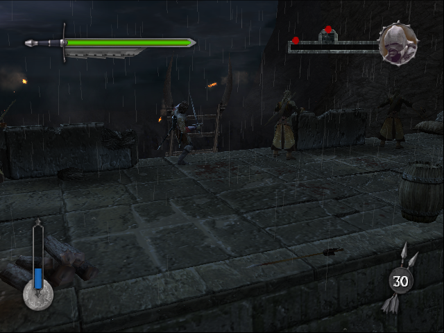 The Lord of the Rings: The Two Towers (PlayStation 2) screenshot: Kicking down the ladders to prevent Helm's Deep from being overrun