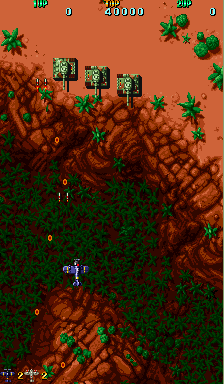 Twin Hawk (Arcade) screenshot: Blast the tanks.