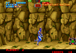 Eight Man (Arcade) screenshot: Small robot on wheels