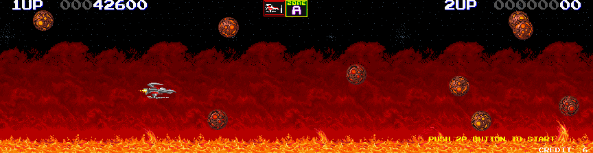 Sagaia (Arcade) screenshot: Flying rocks.