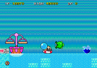 Liquid Kids (Arcade) screenshot: On the water, a dangerous fish coming towards me