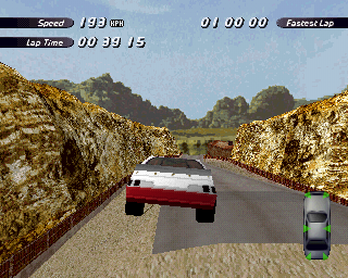 Destruction Derby 2 (PlayStation) screenshot: Racing through Chalk Canyon on a time trial. Taking off like this seems to be encouraged if the commentary is anything to go by