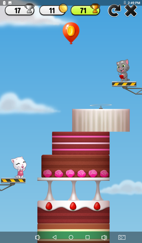 My Talking Tom (Android) screenshot: Cake tower mini game: In this game you must tap the screen to put cakes without letting one fall.