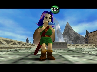 The Legend of Zelda: Majora's Mask (Nintendo 64) screenshot: You'll accumulate a wide variety of masks during the course of the game. Posing here with the ocarina to have a better look at the mask