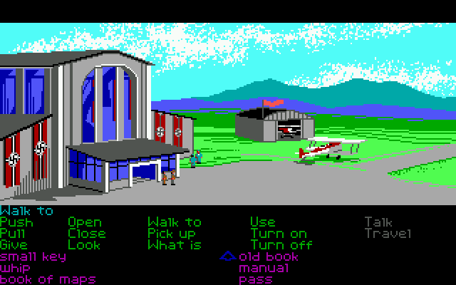 Indiana Jones and the Last Crusade: The Graphic Adventure (DOS) screenshot: The airport (EGA) - Indy and Henry have their eyes on a nice biplane...