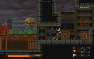 Eat This (Windows) screenshot: Leon can push certain crates and other items to reveal passageways and/or to climb higher.