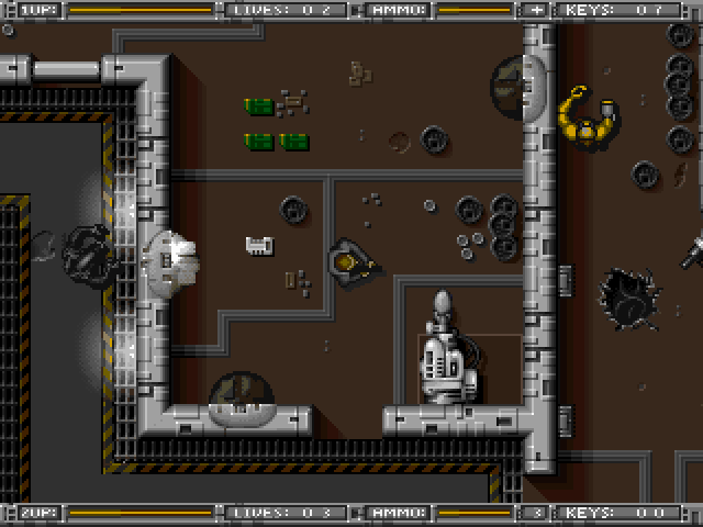 Alien Breed: Tower Assault (DOS) screenshot: Beware of guns mounted on the walls.