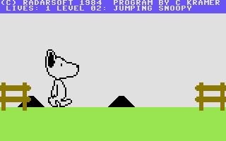 Snoopy (Commodore 64) screenshot: Jumping over moving bumps on the ground.